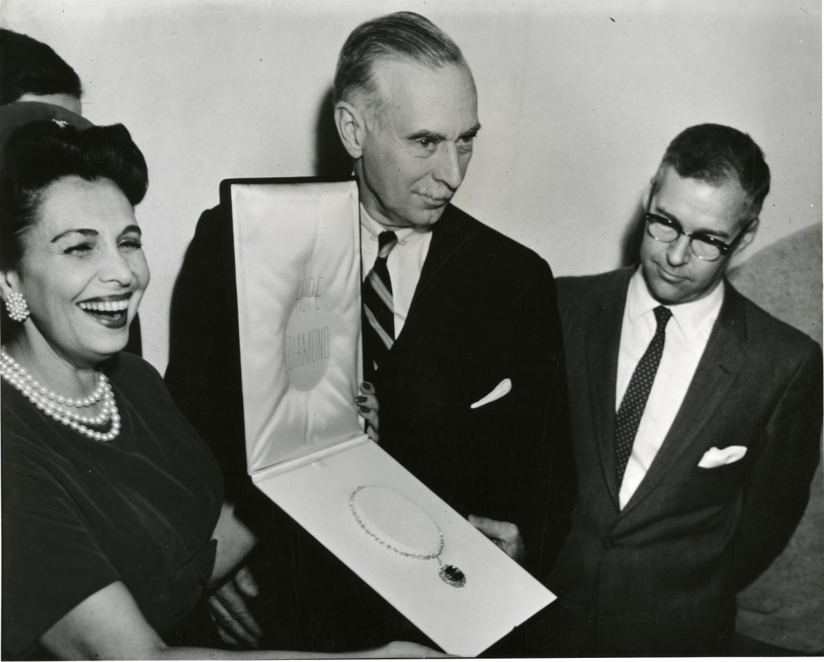 Historic Images of the Smithsonian Institution. Mrs. Edna Winston presenting the Hope Diamond to Secretary Leonard Carmichael and George Switzer, 1958.